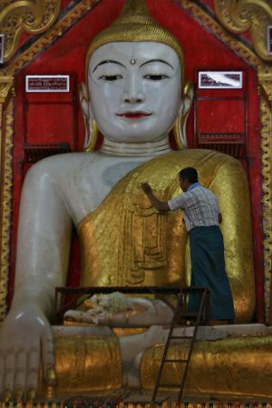 Applying Gold Leaf to Buddha.jpg